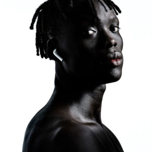Prince Del - Zoo Magazine - NYC 2020 by Albert watson, portrait of black male model wearing airpods in front of white background