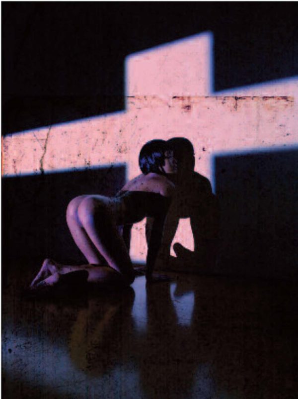 Erotic Nude_2010 by Andreas H. Bitesnich, nude model on all fours next to a wall with a oink cross light projected onto