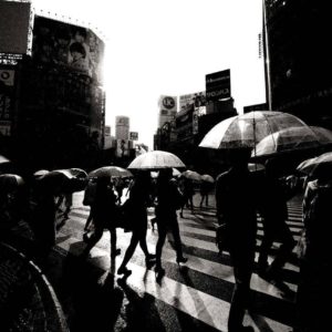 Shibuya Crossing, Tokyo by Andreas H. Bitesnich, people with clear umbrellas crossing the street