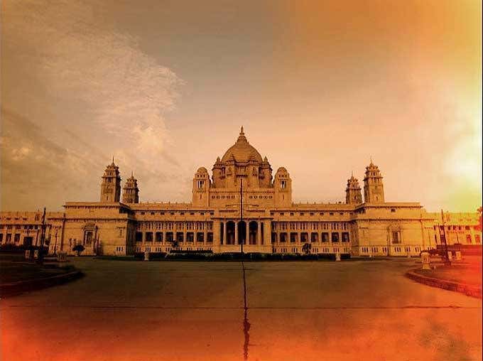 Umaid Bhzawan Palace by Andreas H. Bitesnich, the palace facade in orange and yellow