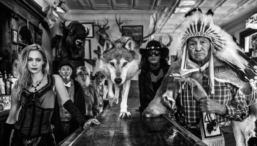 Crazy Horse by David Yarrow, wild west bar szene with native american and wolf