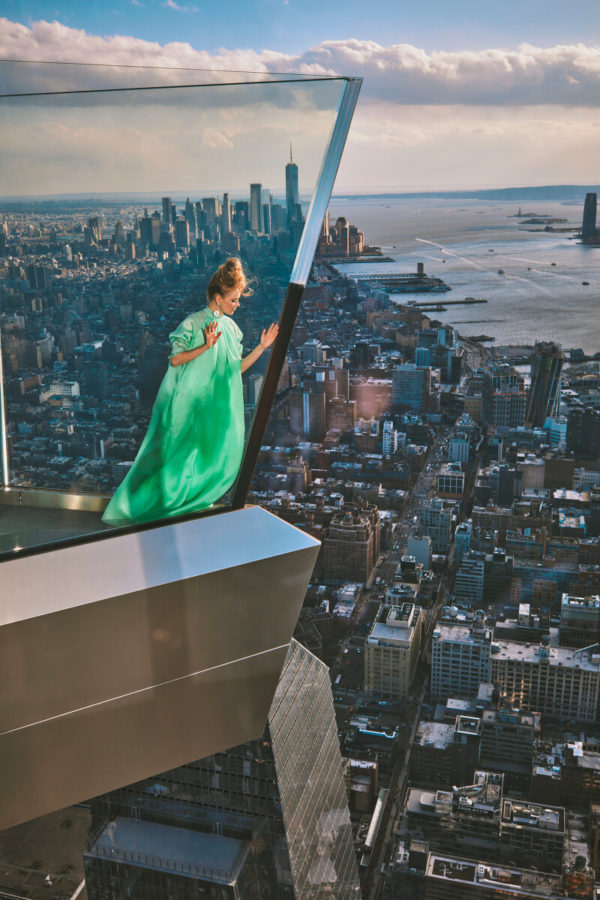 Hadley Robinson I by Guy Aroch, the actress in a green gown on the One Vanderbilt skyscraper looking over New York