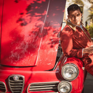 Orlando Bloom II by Guy Aroch, the actor in a red onepiece holding a
