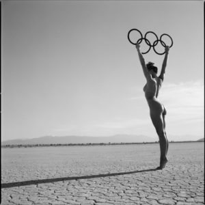 OLYMPIC GERMANY RINGS 2 by Guido Argentini, nude model in the desert, holding up the olympic rings