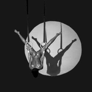 OLYMPIC PLAYBOY by Guido argentini, male nude on rings, casting a shadow
