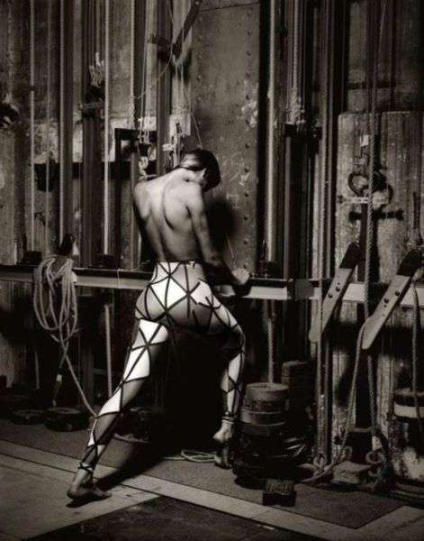 Gabrielle Reece for Vivienne Westwood by Albert Watson, the model in graphic print leggings in the backstage area of a theater