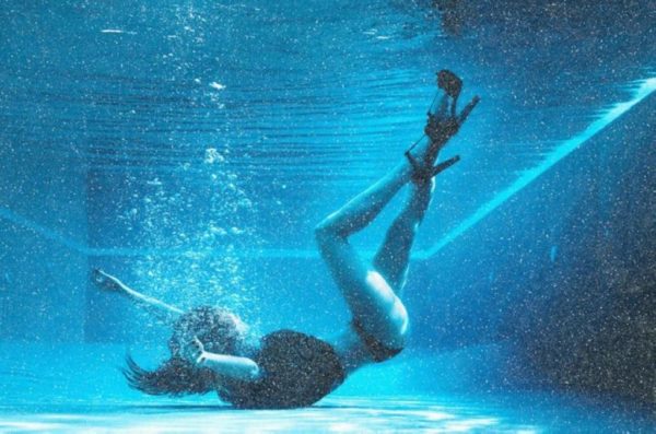 Below the Surface Diamond Dust by David Drebin, model in heels in a pool underwater