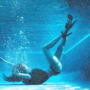 Below the Surface Diamond Dust by David Drebin, model in heels in a pool underwater