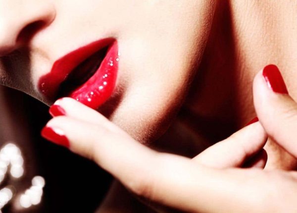 Lips and fingers by David Drebin, closeup of red lips and nails