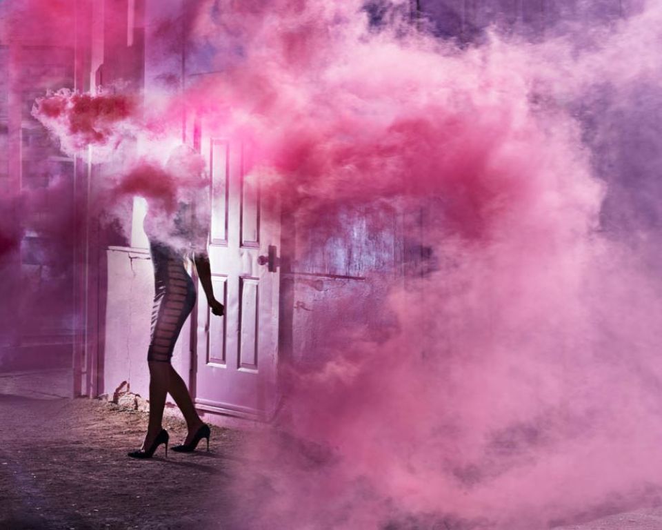Smokeshow by David Drebin, model in tight black dress surrounded by pink smoke
