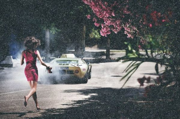Wheels and heels diamond dust by David Drebin, model in pink dress running a fter a car