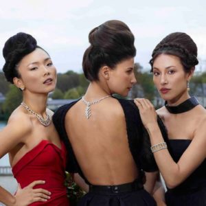 Haute jewelery by Iris Brosch, portrait of three models in gowns, updos and diamon jewelery next to a lake