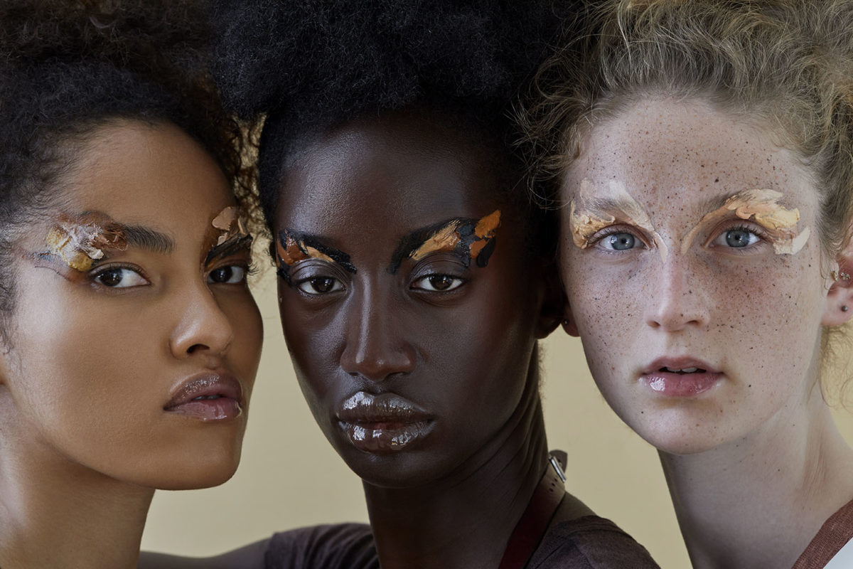 What is Beauty by Iris Brosch, closeup portrait of three model with different skintones and abstract skin toned eye makeup