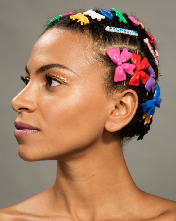 Adeline, Afropunk by Marc Baptiste, portrait of black model wearing cornrows with colorful plastic hairclips