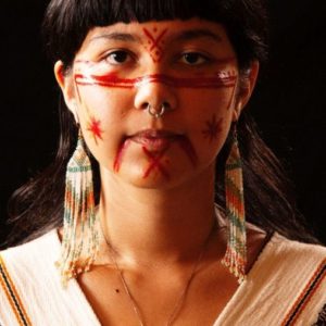 Aniwa Gathering II by Marc Baptiste, portrait of indigenous person with red face markings and traditional jewelery and dress