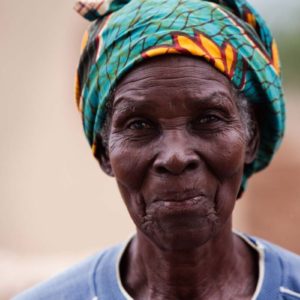 Burkinafaso Ouagadougou by marc Baptiste, portrait of an older black woman wearing a colorful turban