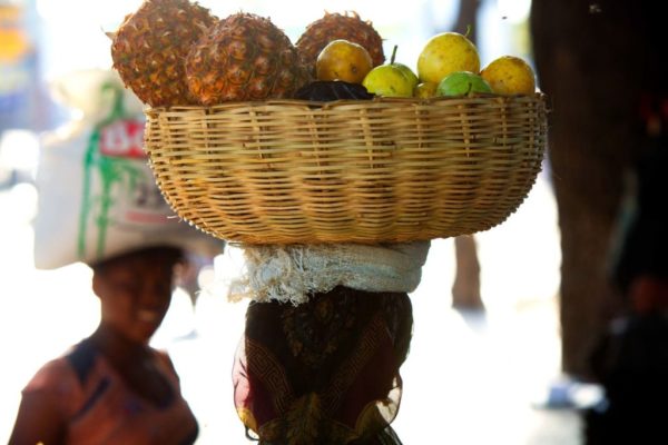 Haiti by Marc Baptiste, woman carrying a fruit basket on her head