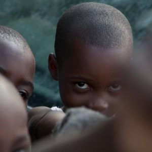 Haiti I by Marc Baptiste, closeup of children, one of them looking into the camera