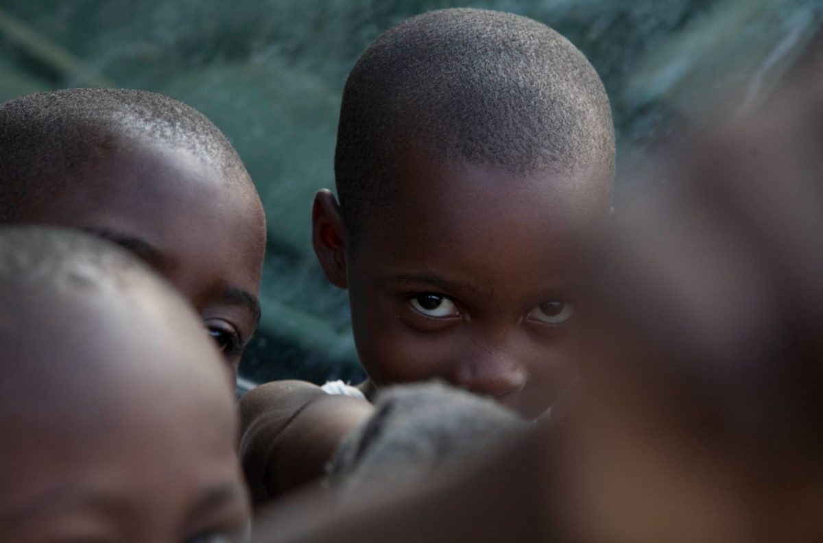 Haiti I by Marc Baptiste, closeup of children, one of them looking into the camera