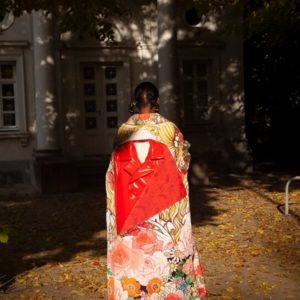 Untitled VII by Marc Baptiste, model in Comme des Garçons kimono inspired cloak in a backyard
