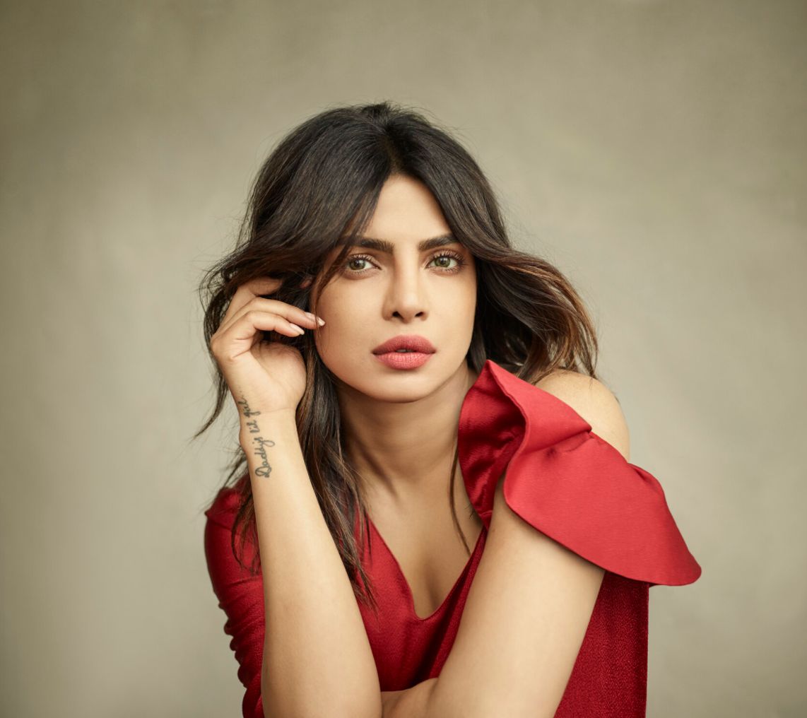 Priyanka Chopra by Mark Seliger, portrait of the actress in a red dress