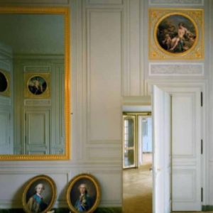 Cabinet Interieur de Madame Adelaide by Robert Polidori, baroque interior with white walls, a huge gold framed morror and oval portraits on the ground