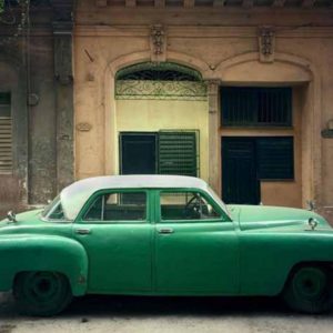 Green Car, Havana, Cuba by Robert Polidori, oldtimer car in front of historic entryway to a building