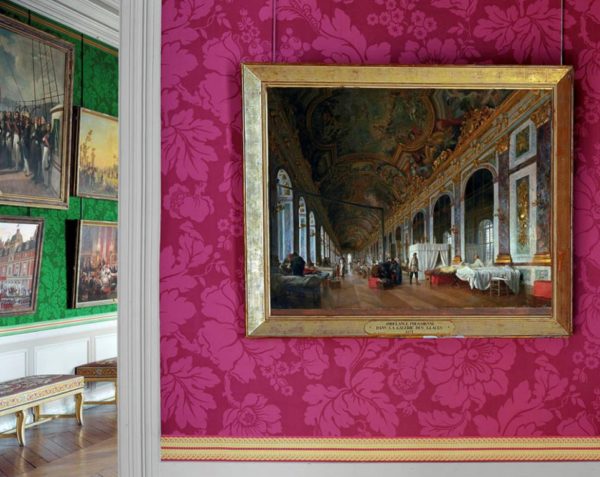 La Galerie des Glaces, Chateau de Versailles, France by Robert Polidori, view of a gallery with old oil paintings on pink and green wallpaper