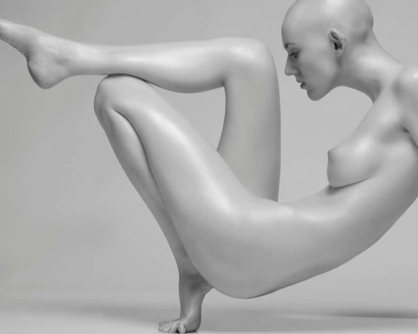 The Angle by Sylvie Blum, bald model crouching