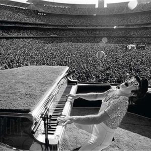 Elton John, Dodger Stadium by Terry O'Neill, the singer at the piano playing at the stadium