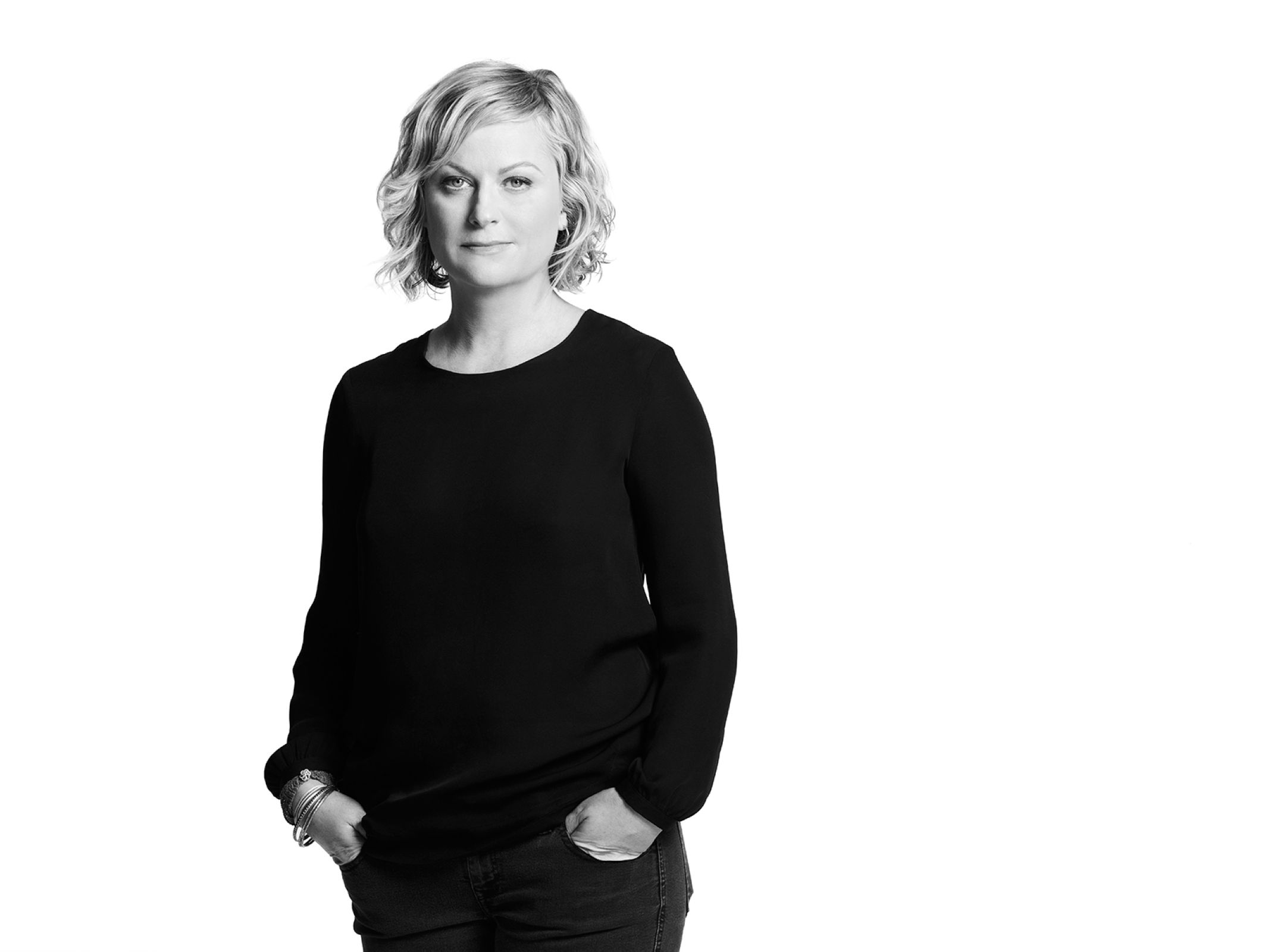 Amy Poehler by Timothy White, black and white portrait of the actress in a black shirt