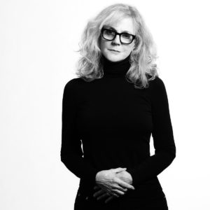 Blythe Danner By Timothy White, black and white portrait of the actress in glasses and black turtleneck