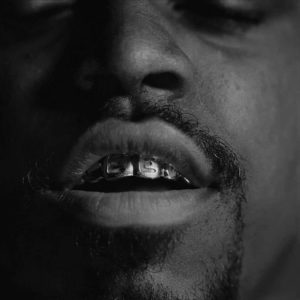 Outkast, Grills by Timothy White, closeupe of a mouth with grills on the teeth