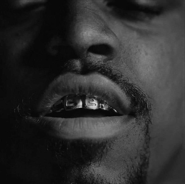 Outkast, Grills by Timothy White, closeupe of a mouth with grills on the teeth