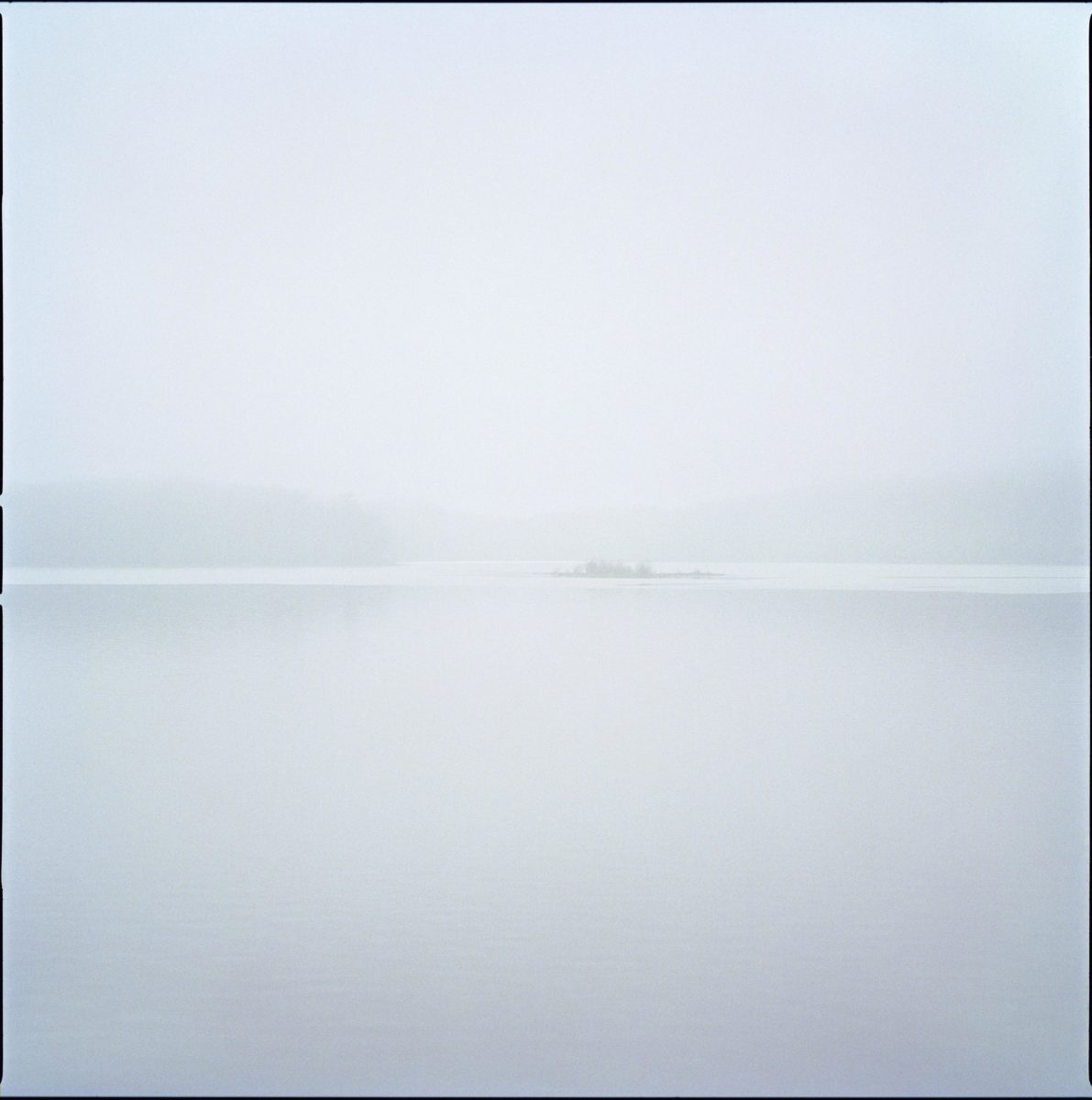 Islands by Nigel Parry from the Landscapes Series, grey and green mist over island in a lake