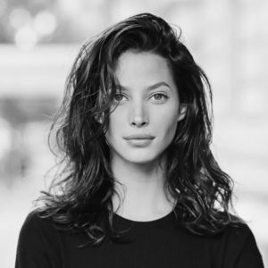 Christy Turlington Arthur Elgort, B6w portrait of the model in a black shirt and messy hair