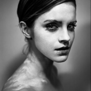 Emma Watson by Vincent Peters, portrait of the actress with white paint on face and neck