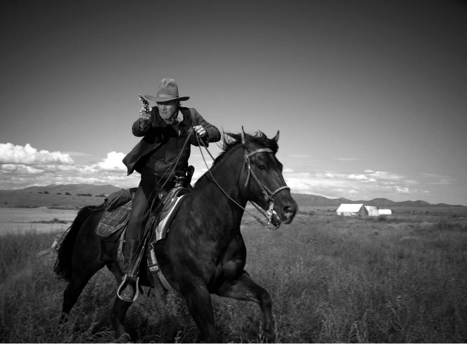Harrison Ford 2010 by Timothy White, the actor with cowboyhat and pisto, on a horse