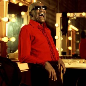 Ray Charles by Timothy White, the singer in a red blouse in a backstage room