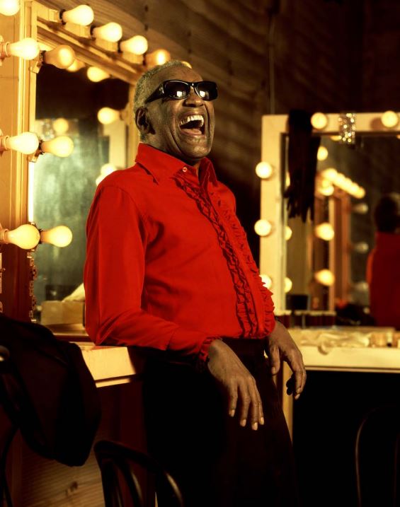 Ray Charles by Timothy White, the singer in a red blouse in a backstage room