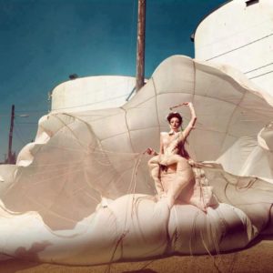 Beach by Kristian Schuller, Model in white dress holding a parachute at the beach