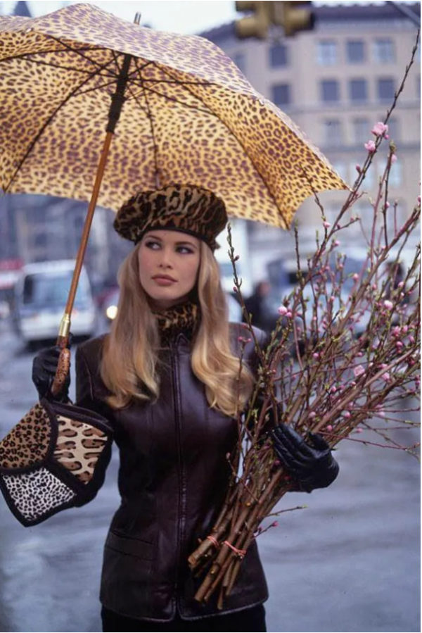 Claudia Schiffer Leopard by Arthur Elgort, the model in leather jacket with leopard print accessoirs, holding cherry twigs