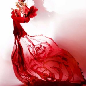 Floating Dress by Kristian Schuller, model in flowing red dress and headpiece on trapeze