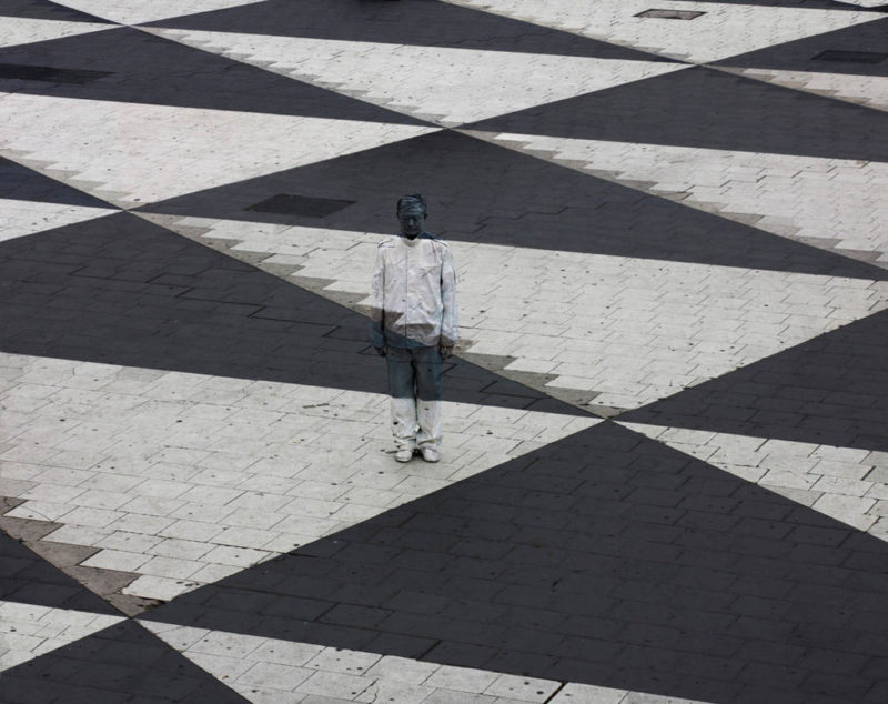 Hiding in Sweden by Leo Bolin, black and white Plaza with person painted to disappear
