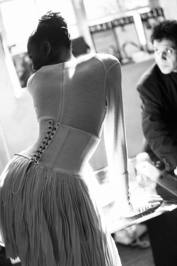 Naomi Campbell and Azzedine Alaia, Paris 1986 by Arthur Elgort, the model in white with corset from the back
