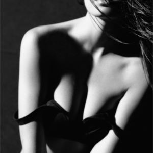 Virag, Paris by Bruno Bisang, b&w closeup of models chest with black bra
