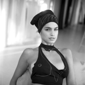 cindy crwaford by Arthur Elgort, black and white portrait of the model in black cutout top and headband