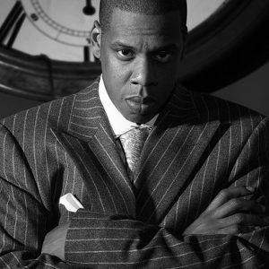 Jay Z by Markus Klinko, black and White Portrait of the Rapper in Pinstripe Suit in front of clock