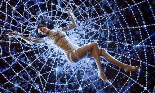 Laetitia Casta by Markus Klinko, the actress lying in a crystal spiderweb