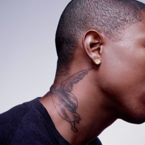 Pharell Williams by Markus Klinko, sideprofile of the singer with neck tattoo